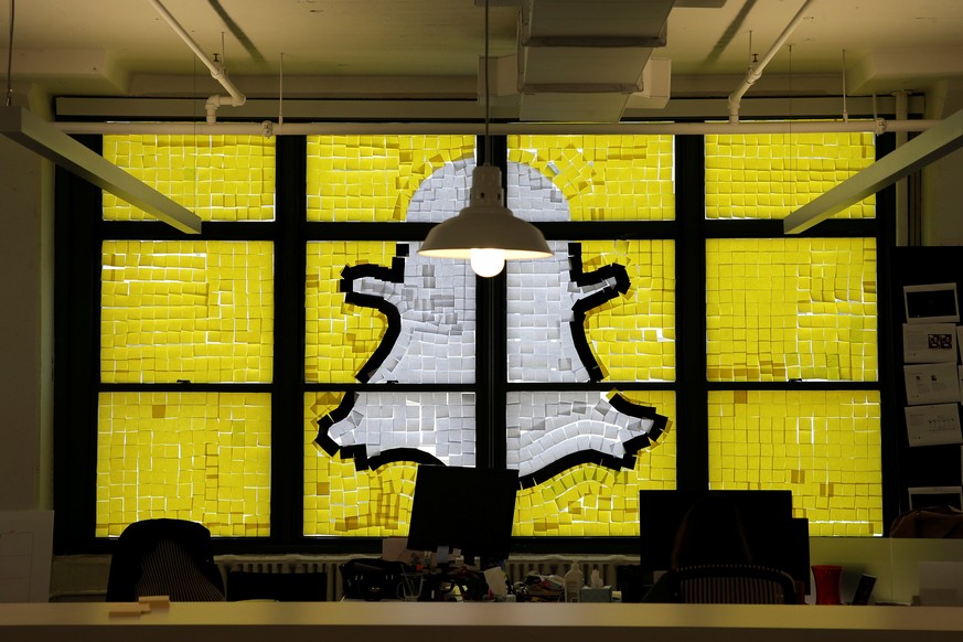 An image of the Snapchat logo created with Post-it notes is seen in the windows of Havas Worldwide at 200 Hudson Street in lower Manhattan, New York, U.S., May 18, 2016, where advertising agencies and ...