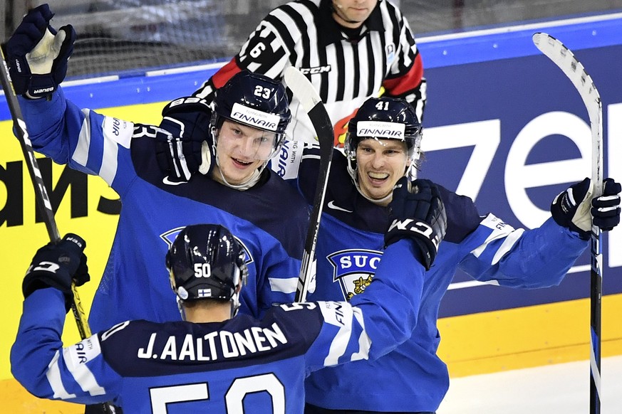 epa05972496 Finland&#039;s forward Joonas Kamppainen (top, L) celebrates with his teammates Antti Pihlstrom (R) and Juhamatti Aaltonen (buttom) after scoring the 2-0 lead during the 2017 IIHF Ice Hock ...