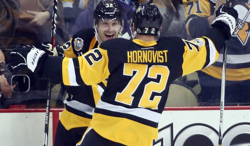 Mar 3, 2017; Pittsburgh, PA, USA; Pittsburgh Penguins defenseman Mark Streit (L) celebrates his goal with right wing Patric Hornqvist (72) against the Tampa Bay Lightning during the third period at th ...