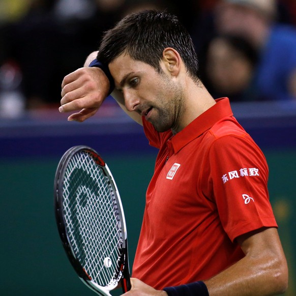 Tennis - Shanghai Masters tennis tournament - Novak Djokovic of Serbia v Roberto Bautista Agut of Spain - Shanghai, China - 15/10/16. Djokovic wipes his forehead. REUTERS/Aly Song