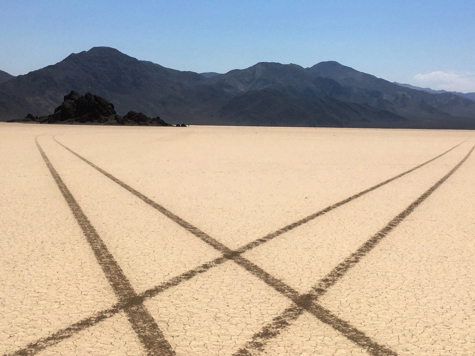 This Aug. 26, 2016 photo provided by the National Park Service shows tire tracks made by a vehicle illegally crossing the Racetrack Playa at Death Valley National Park, Calif. The NPS is trying to tra ...