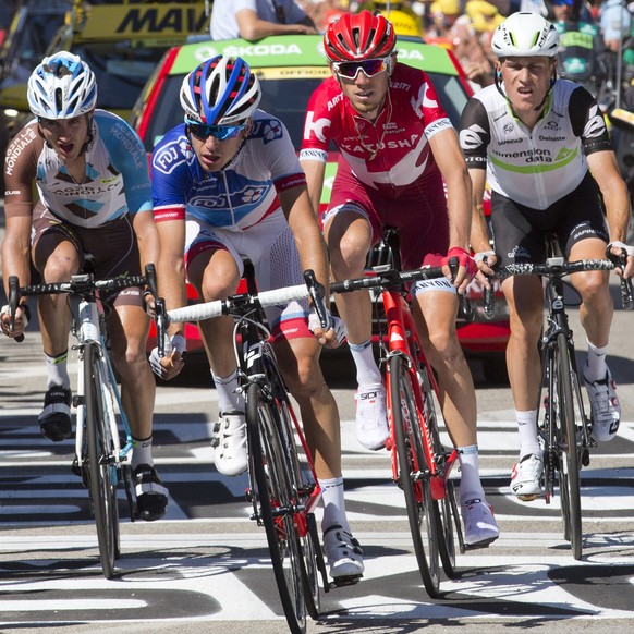 Switzerlands Sebastien Reichenbach, second left, leads a breakaway group with Frances Alexis Vuillermoz, left, Russias Ilnur Zakarin, second right, and Belgiums Serge Pauwels, right, as they pass  ...