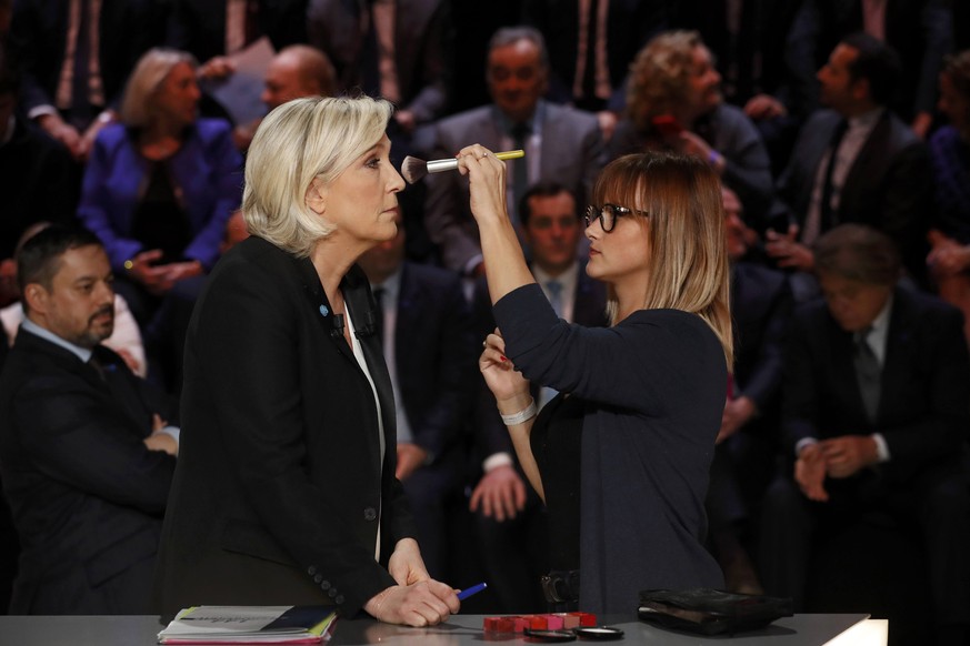 Candidate for the 2017 presidential election Marine Le Pen, French National Front (FN) political party leader, gets make-up before a debate organised by French private TV channel TF1 in Aubervilliers, ...