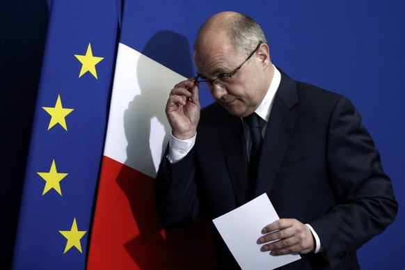 epa05862121 French Interior Minister Bruno Le Roux reacts after delivering a speech to announce his resignation at the Prefecture of Bobigny, near Paris, France, 21 March 2017. Bruno Le Roux resigned  ...