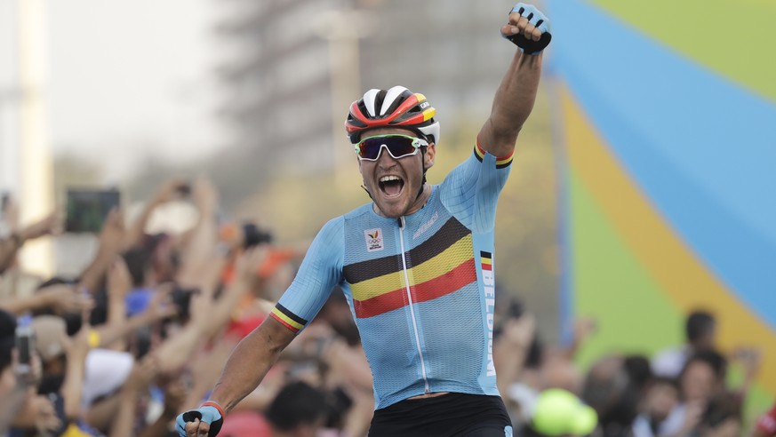 Greg Van Avermaet of Belgium celebrates after crossing the finish line to win the men&#039;s cycling road race final at the 2016 Summer Olympics in Rio de Janeiro, Brazil, Saturday, Aug. 6, 2016. (AP  ...