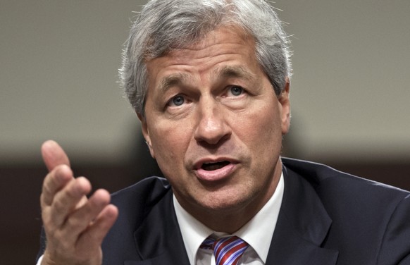 FILE - In this June 13, 2012, file photo, JPMorgan Chase CEO Jamie Dimon testifies before the Senate Banking Committee on Capitol Hill in Washington. During calls with reporters and Wall Street analys ...