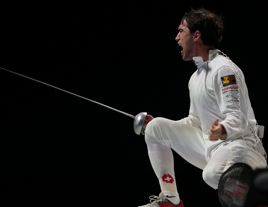 Max Heinzer, of Switzerland, left, reacts after the bronze medal match at men&#039;s team epee competition at the fencing World championships in Moscow, Russia, on Saturday, July 18, 2015. Ukraine won ...