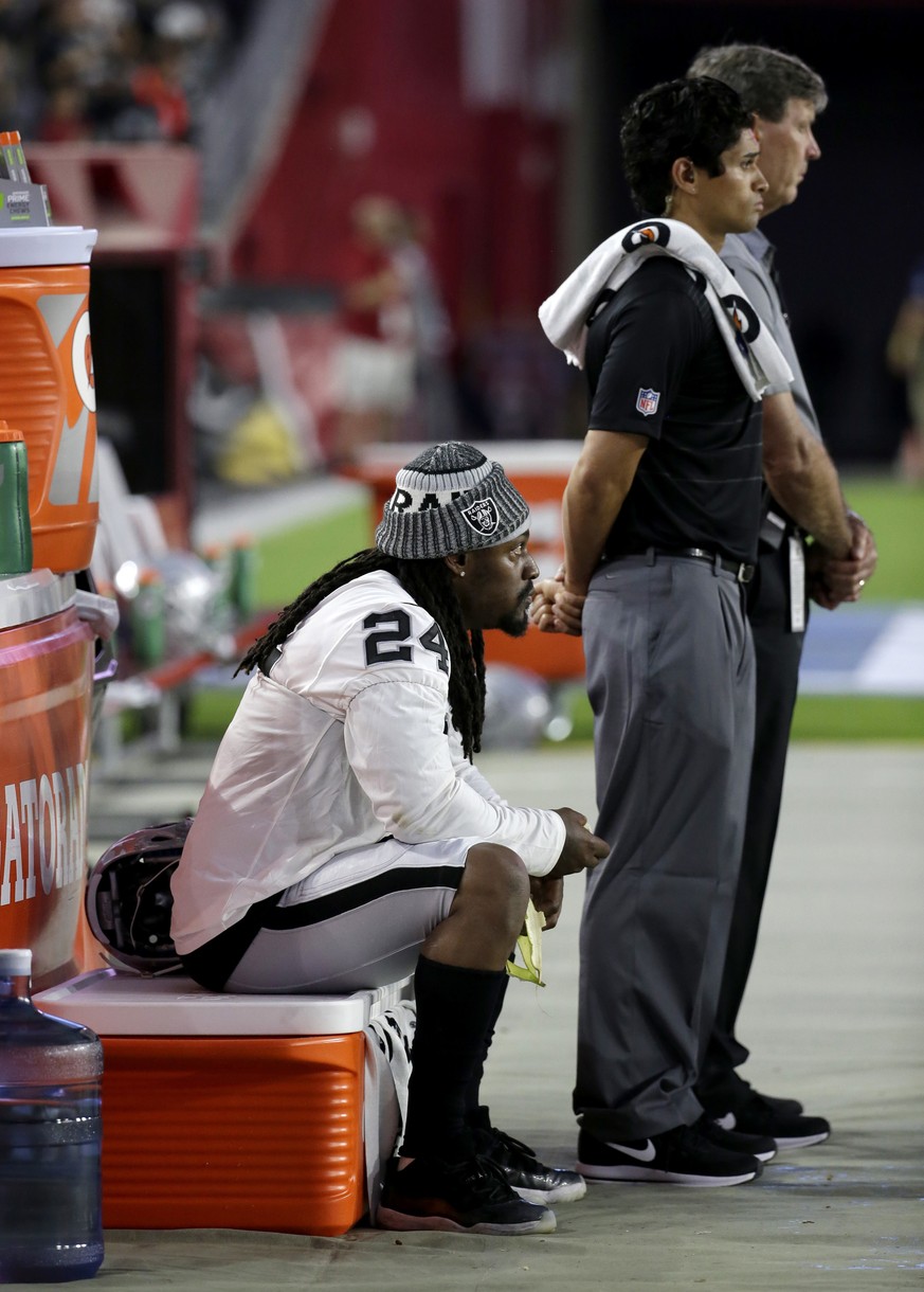 FILE - In this Aug. 12, 2017, file photo, Oakland Raiders running back Marshawn Lynch sits during the national anthem prior to the team&#039;s NFL preseason football game against the Arizona Cardinals ...