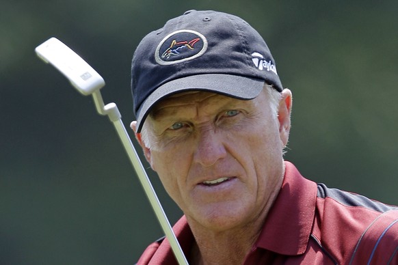 FILE - In this June 28, 2012 file photo, Greg Norman watches his putt on the 16th hole during the first round of the Senior Players Championship golf tournament at the Fox Chapel Country Club in Fox C ...