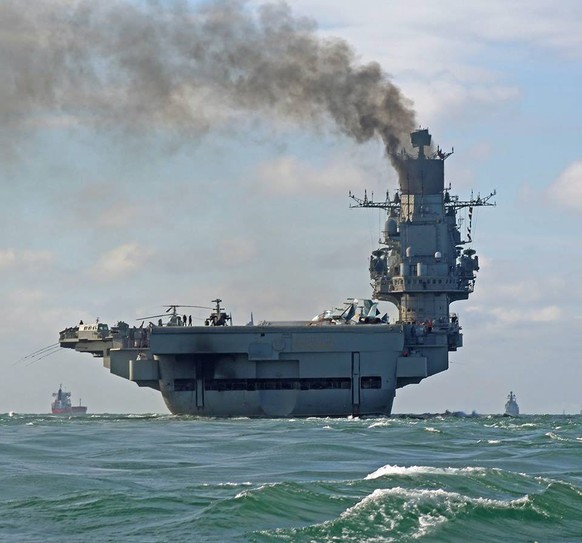 epa05596278 A handout photograph made available by Dover Marina.com on 21 October 2016 showing Russian aircraft carrier Admiral Kuznetsov in the English Channel, 21 October 2016. The Russian Task Grou ...