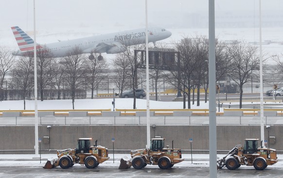 An American Airlines plane departs during the snowstorm at O&#039;Hare International Airport in Chicago, Illinois, U.S., March 13, 2017. Some areas received up to 5 inches of snow, and more than 400 f ...