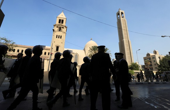 Members of the special police forces stand guard to secure the area around St. Mark&#039;s Coptic Orthodox Cathedral after an explosion inside the cathedral in Cairo, Egypt December 11, 2016. REUTERS/ ...