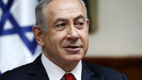 FILE - In this Sunday, Jan. 22, 2017, file photo, Israeli Prime Minister Benjamin Netanyahu attends the weekly cabinet meeting in Jerusalem. An Israeli newspaper quoted President Donald Trump on Frida ...