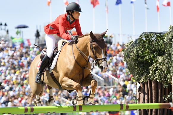 Janika Sprunger of Switzerland rides her horse Bonne Chance CV during the Equestrian Jumping individual and team qualifier in the Olympic Equestrian Centre in Rio de Janeiro, Brazil, at the Rio 2016 O ...