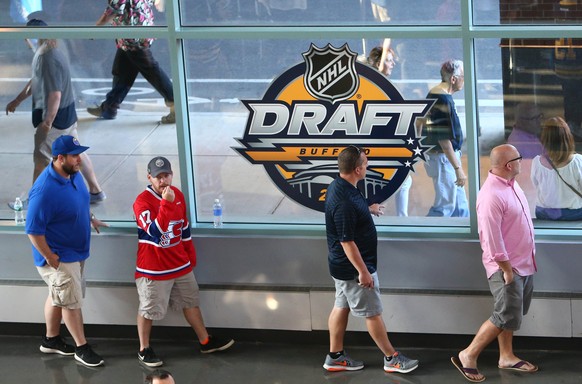 Jun 24, 2016; Buffalo, NY, USA; A general view as hockey fans walk past a NHL Draft window decal before the first round of the 2016 NHL Draft at the First Niagra Center. Mandatory Credit: Jerry Lai-US ...