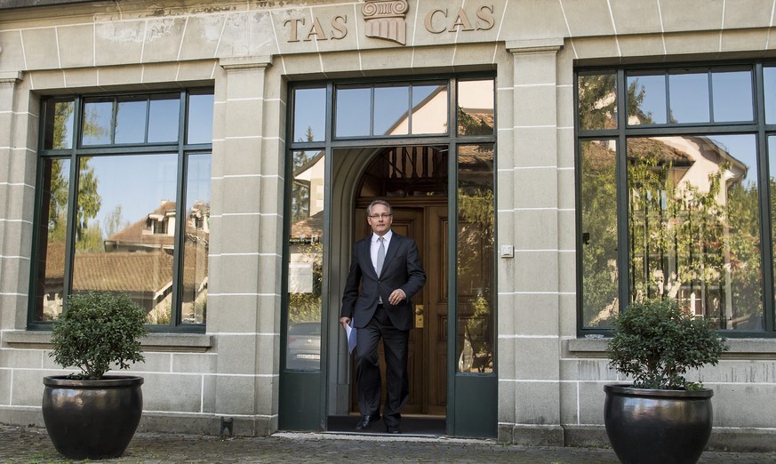 epa05569852 Matthieu Reeb, General Secretary of the Court of Arbitration for Sport (CAS) arrives to speak to journalists during the release of the decision in the case between Russian tennis player Ma ...