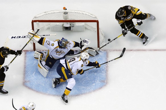 Pittsburgh Penguins&#039; Patric Hornqvist (72) has a wraparound shot stopped by Nashville Predators goalie Pekka Rinne (35) with Roman Josi (59) defending during the first period of Game 2 of the NHL ...