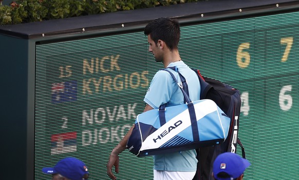 epa05851018 Novak Djokovic of Serbia walks off the court after losing to Nick Kyrgios of Australia in their match at the 2017 BNP Paribas Open tennis tournament at the Indian Wells Tennis Garden in In ...