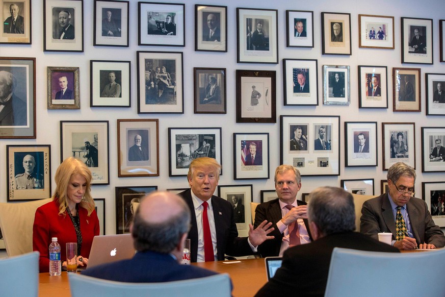 Kellyanne Conway, from left, President-elect Donald Trump, New York Times Publisher Arthur Sulzberger Jr., and vice chairman of The New York Times Company Michael Golden appear during a meeting with e ...