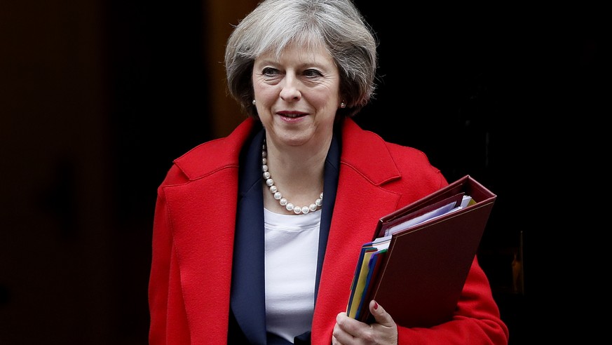 FILE - In this Wednesday, Nov. 23, 2016 file photo, Britain&#039;s Prime Minister Theresa May leaves 10 Downing Street to attend the weekly Prime Ministers&#039; Questions session, in parliament in Lo ...