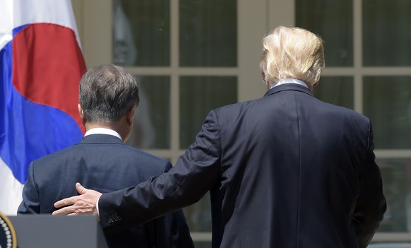 President Donald Trump and South Korean President Moon Jae-in walk off of the stage after making statements in the Rose Garden of the White House in Washington, Friday, June 30, 2017. (AP Photo/Susan  ...