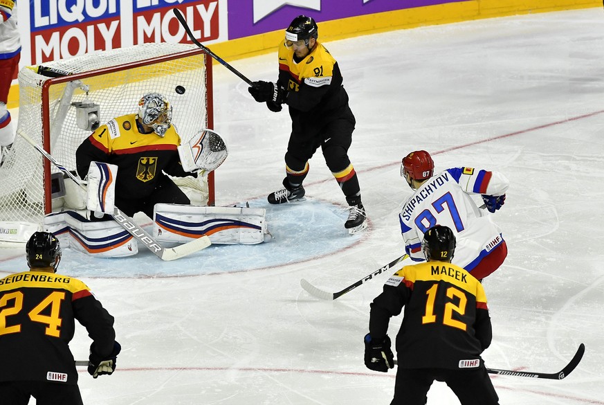 Russia&#039;s forward Vadim Shipachyov scores against Germany&#039;s goalkeeper Thomas Greiss the first goal during the Ice Hockey World Championships group A match between Germany and Russia at the L ...