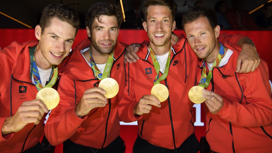 From left, Lucas Tramer, Mario Gyr, Simon Schuerch, Simon Niepmann and Mario Gyr of Switzerland pose with their gold medal after winning in the Lightweight-Four during a medal celbration in the House  ...