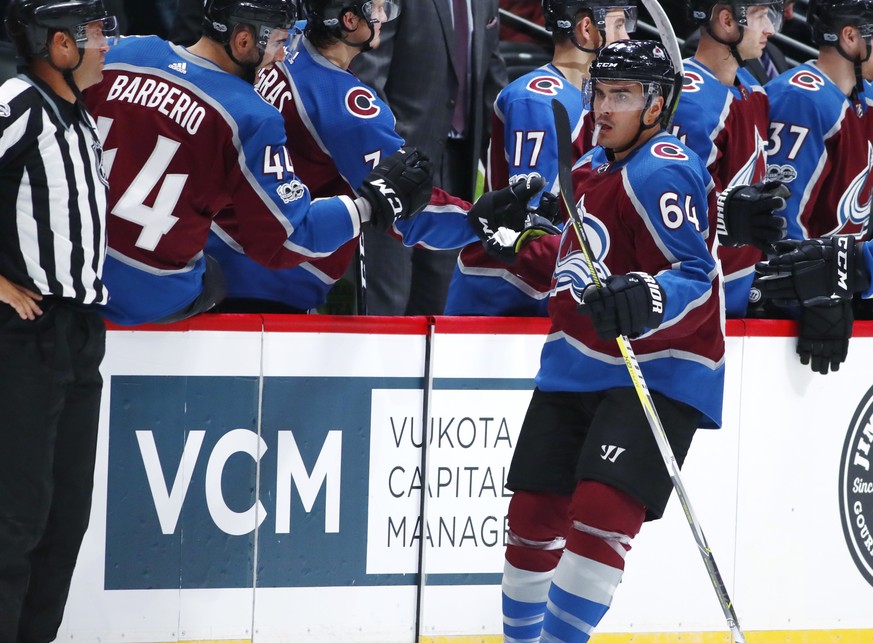 Colorado Avalanche right wing Nail Yakupov, of Russia, front, is congratulated as he passes the team box after scoring a goal against the Boston Bruins in the second period of an NHL hockey game Wedne ...
