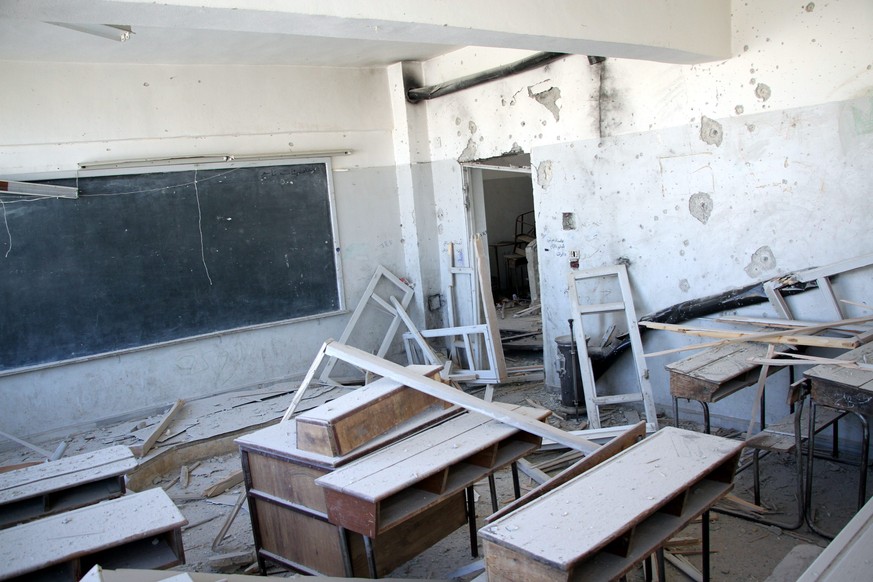 epa05605876 A general view for damages that occured at a school that was bombed a day earlier in rebel-held Idlib, northern Syria, 27 October 2016. At least 35 people were killed in a bombing on a sch ...