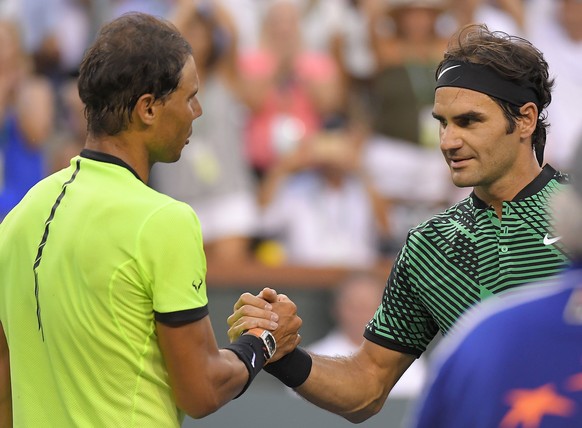 Roger Federer, of Switzerland, right, shakes hands with Rafael Nadal, of Spain, after their match at the BNP Paribas Open tennis tournament, Wednesday, March 15, 2017, in Indian Wells, Calif. Federer  ...