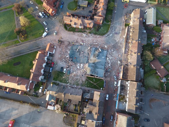 epa05871525 An aerial view 26 March 2017 over the the devastated buildings destroyed late 25 March 2017 by a an explosion in Bebington, Wirral, near Liverpool, Britain. Reports state two people have b ...