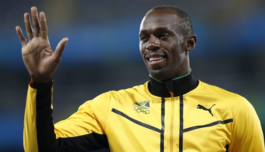 epa05503679 Usain Bolt of Jamaica poses on the podium after winning the men&#039;s 4x100m relay final of the Rio 2016 Olympic Games Athletics, Track and Field events at the Olympic Stadium in Rio de J ...