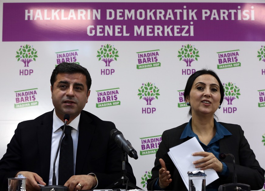 Co-chairmen of pro-Kurdish People&#039;s Democratic Party, or HDP, Selahattin Demirtas, left, and Figen Yuksekdag speak to the media in Ankara, Turkey, Sunday, Nov. 1, 2015. Turkeys ruling Justice an ...
