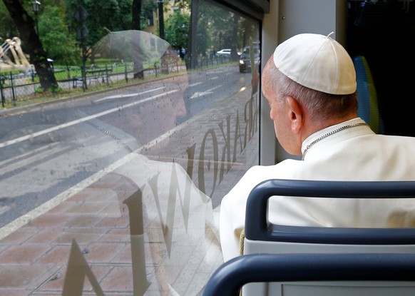 Pope Francis waves as he arrives by tram at the World Youth Day in Krakow, Poland July 28, 2016. REUTERS/Stefano Rellandini