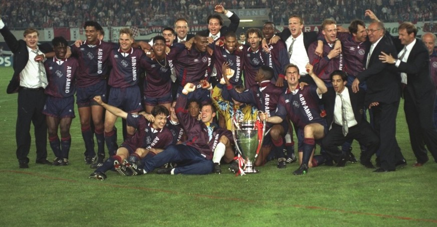 24 May 1995: The Ajax team celebrate with the trophy after their victory in the European Cup Final against AC Milan in Vienna, Austria. Ajax won the match 1-0.
Mandatory Credit: Clive Brunskill/Allspo ...