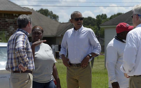 President Barack Obama tours Castle Place, a flood-damaged area of Baton Rouge, La., Tuesday, Aug. 23, 2016. Obama is making his first visit to flood-ravaged southern Louisiana as he attempts to assur ...