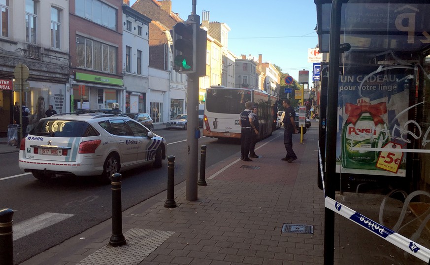 Police secure the scene around a bus stop after a knife attack in Brussels on Monday, Aug. 22, 2016. A knife-wielding woman stabbed three people in Brussels on Monday and was later shot by police when ...