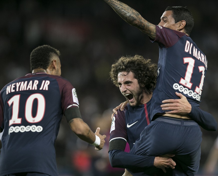 PSG&#039;s Adrien Rabiot, center, PSG&#039;s Angel Di Maria smile to PSG&#039;s Neymar, left, after scoring during the French League One soccer match between PSG and Toulouse at the Parc des Princes s ...