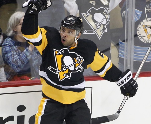 Pittsburgh Penguins&#039; Trevor Daley (6) celebrates his goal with teammate Brian Dumoulin (8) during the first period of an NHL hockey game against the Washington Capitals in Pittsburgh, Sunday, Mar ...