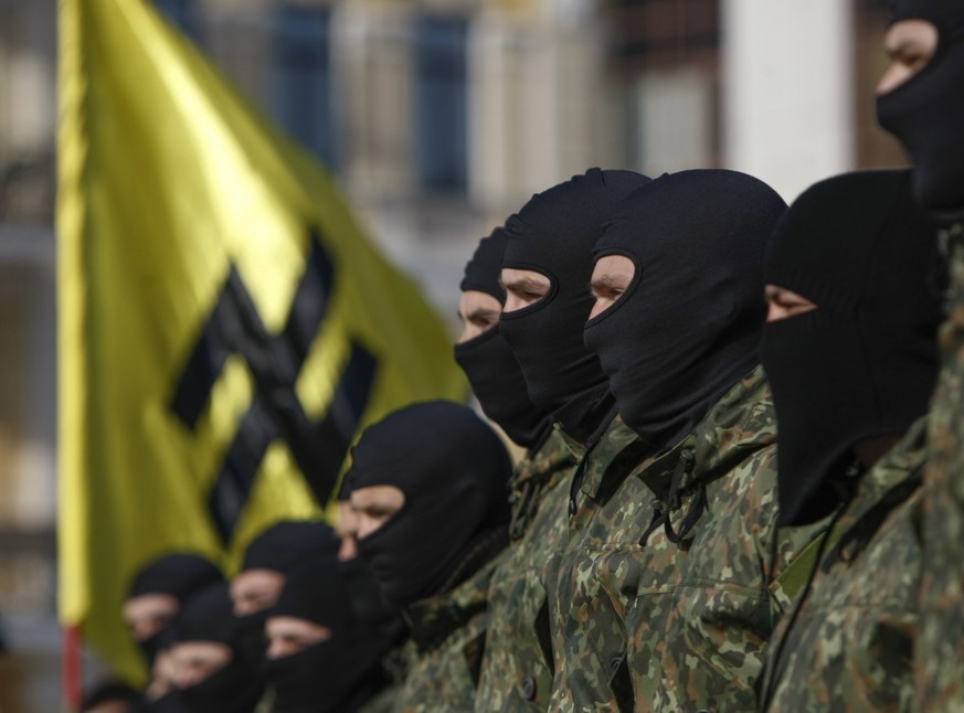 New volunteers for the Ukrainian interior ministry&#039;s &quot;Azov&quot; battalion take their oath of allegiance to their country during a ceremony in Kiev October 19, 2014. According to the battali ...