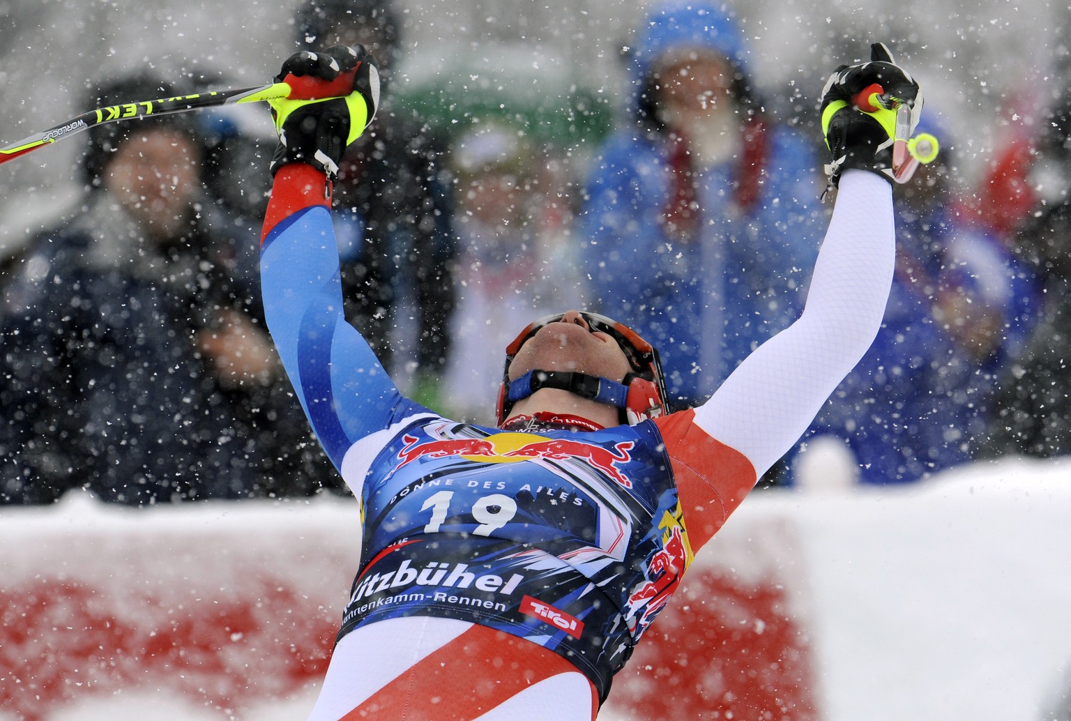 Didier Cuche, of Switzerland, celebrates in the finish area after winning an alpine ski, men&#039;s World Cup downhill, in Kitzbuehel, Austria, Saturday, Jan. 21, 2012. Didier Cuche won the classic Wo ...