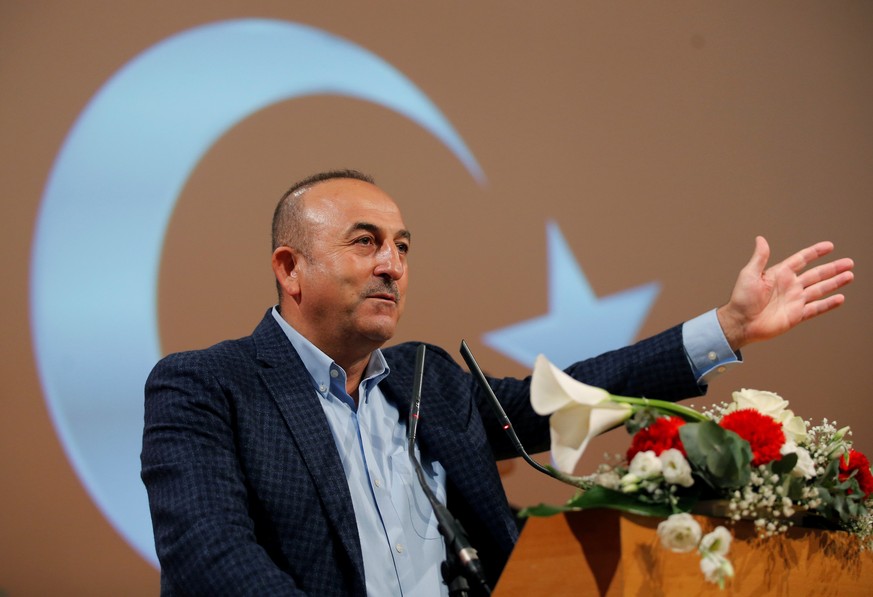 Turkish Foreign Minister Mevlut Cavusoglu addresses supporters during a political rally on Turkey&#039;s upcoming referendum, in Metz, France, March 12, 2017. REUTERS/Vincent Kessler TPX IMAGES OF THE ...