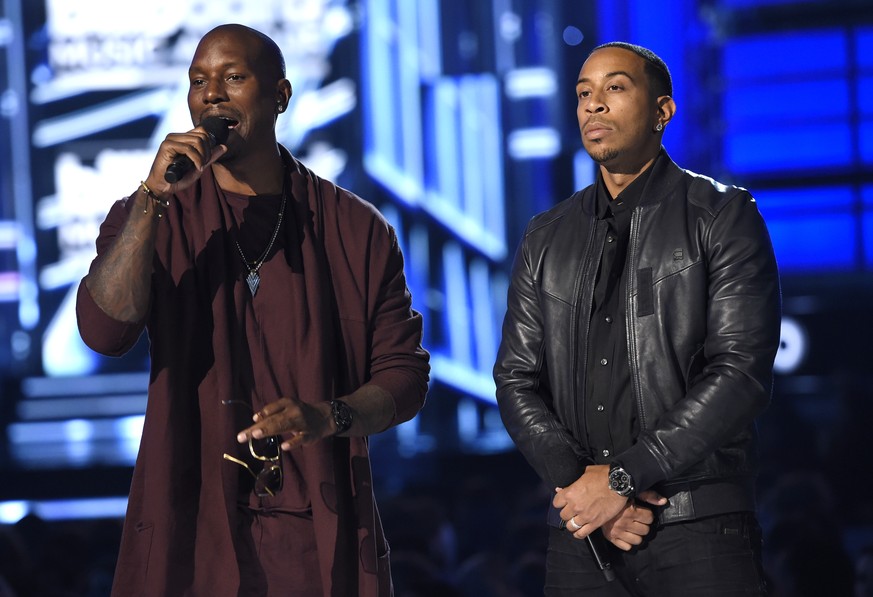 Tyrese, left, and host Ludacris introduce a performance by Wiz Khalifa, Charlie Puth, and Lindsey Stirling at the Billboard Music Awards at the MGM Grand Garden Arena on Sunday, May 17, 2015, in Las V ...