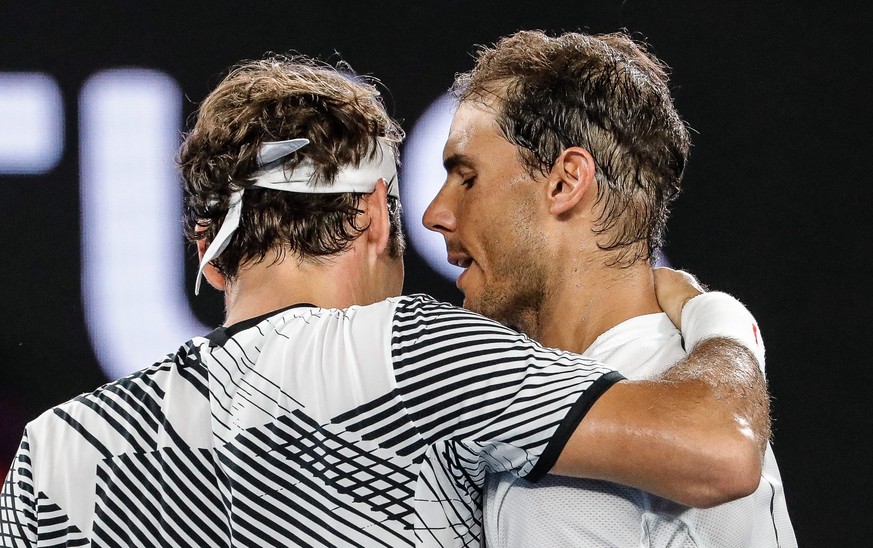 epa05759191 Roger Federer (L) of Switzerland celebrates after winning the Men&#039;s Singles final match against Rafael Nadal (R) of Spain at the Australian Open Grand Slam tennis tournament in Melbou ...