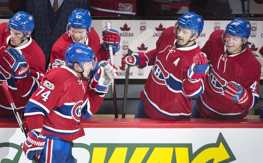 Montreal Canadiens&#039; Alexei Emelin (74) celebrates with teammates Artturi Lehkonen (62), Tomas Plekanec (14) and Sven Andrighetto (42) after scoring against the New York Rangers during third-perio ...