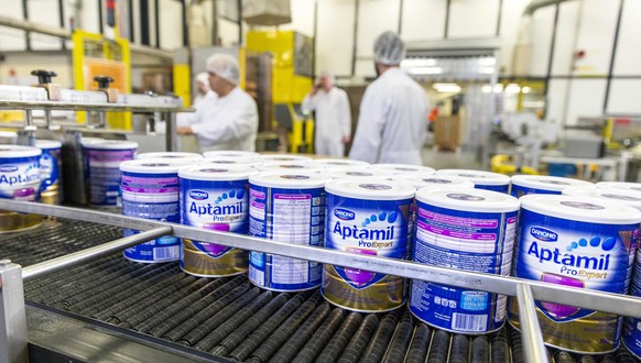 epa05051996 Aptamil baby formula cans at a production line of Danone Nutricia Early Life Nutrition division, in Cuijk, The Netherlands, 02 December 2015. French company Danone is building a new factor ...
