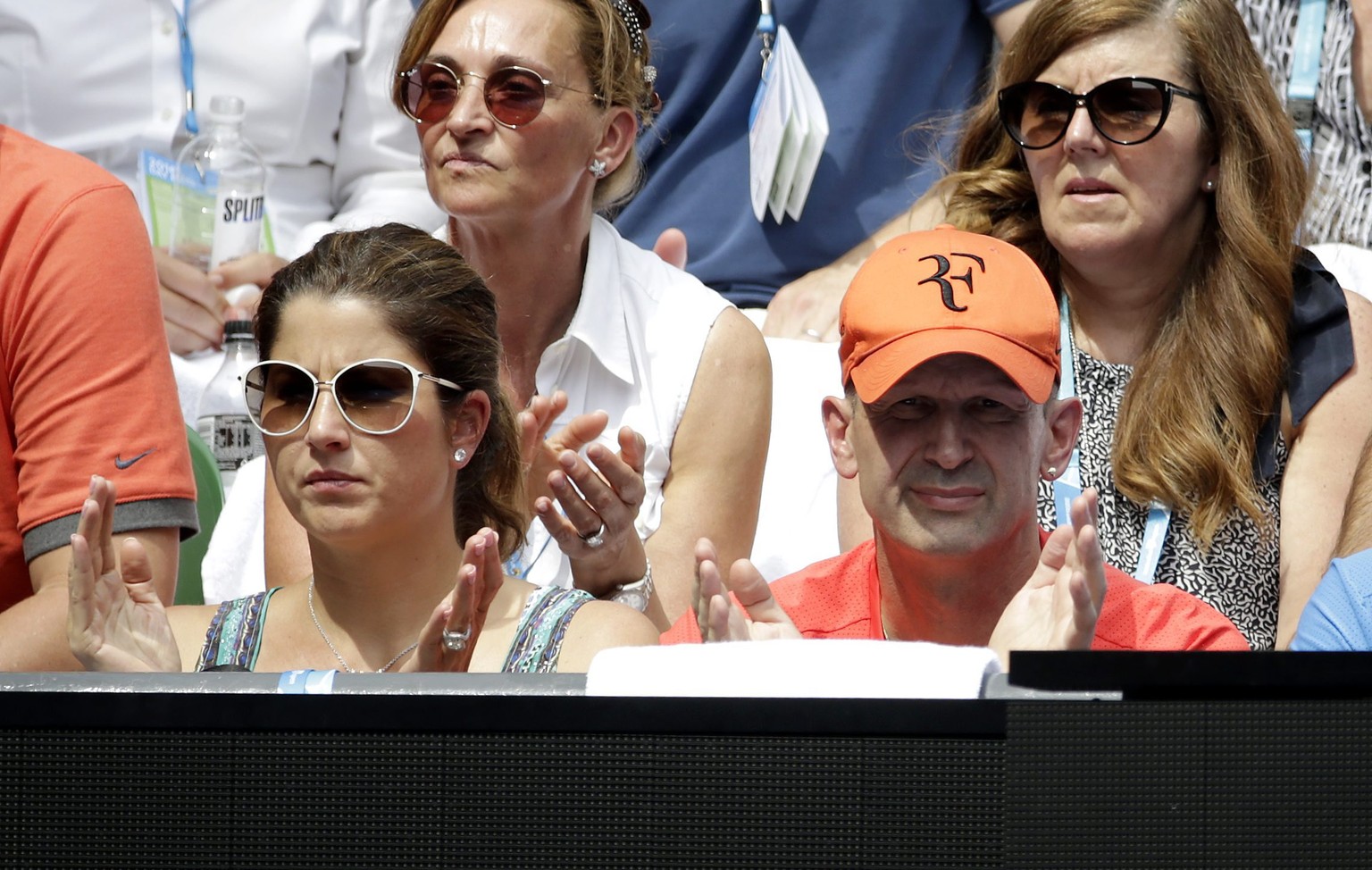 epa05126202 Ivan Ljubicic (R), the coach of Roger Federer of Switzerland and Mirka Federer watch the quarter final match between Roger Federer against Tomas Berdych of Czech Republic at the Australian ...