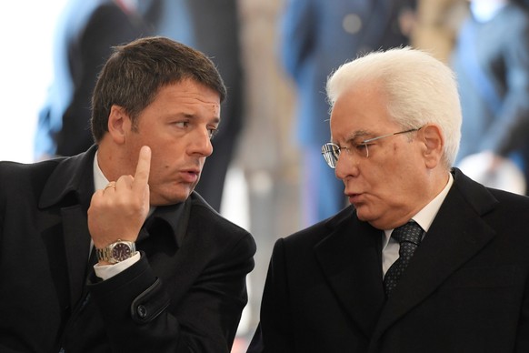 Italian Prime Minister Matteo Renzi talks to President Sergio Mattarella before a ceremony led by Pope Francis to close the Holy Door marking the closing of the Catholic Jubilee Year of Mercy in Saint ...