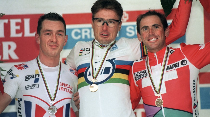 Winners podium of the men&#039;s time trial at the World Road Cycling championships in Lugano, October 10, 1996: Goldmedal winner Alex Zuelle (center) is flanked by second placed Christopher Boardman  ...