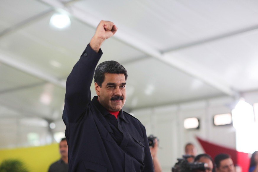 epa06111833 A handout photo made available by Miraflores Press office shows Venezuelan President Nicolas Maduro during a government ceremony in Caracas, Venezuela, 26 July 2017. During the ceremony Ma ...